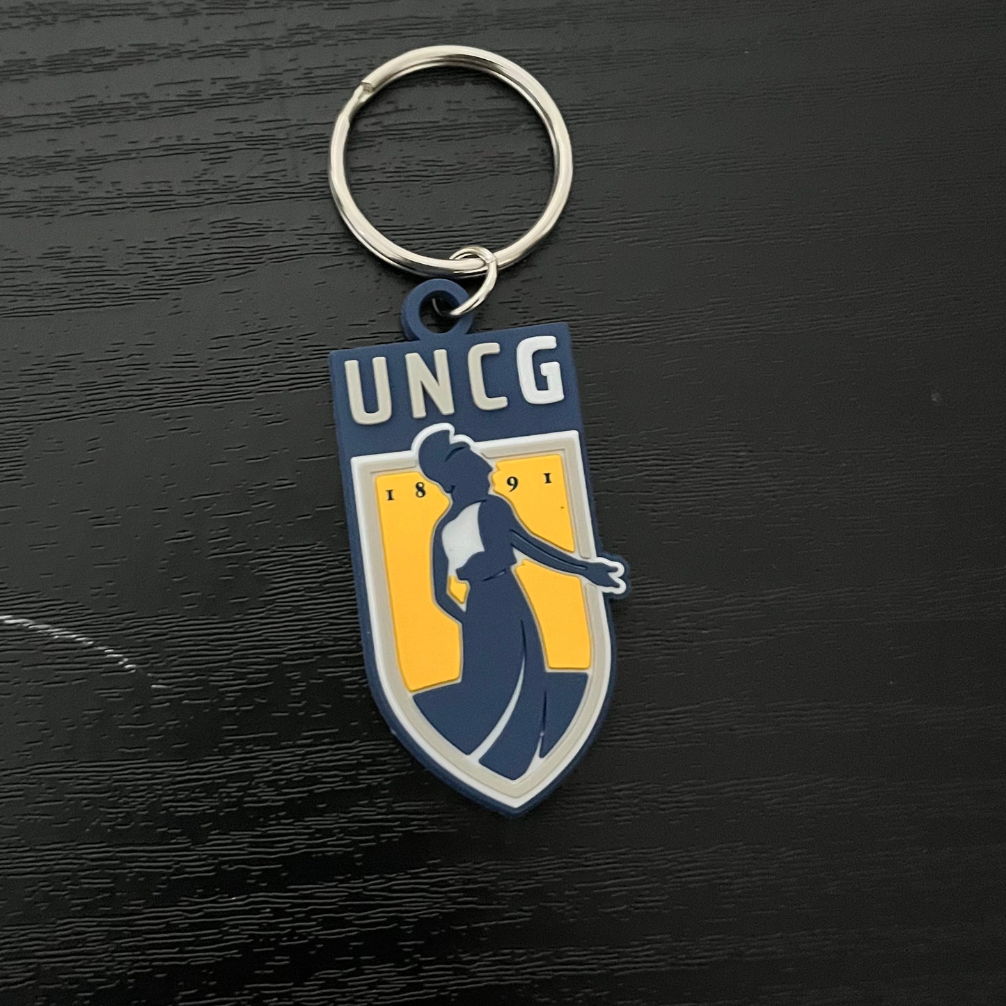 Key Chain - UNCG Emblem logo in PVC material, poly-bagged.