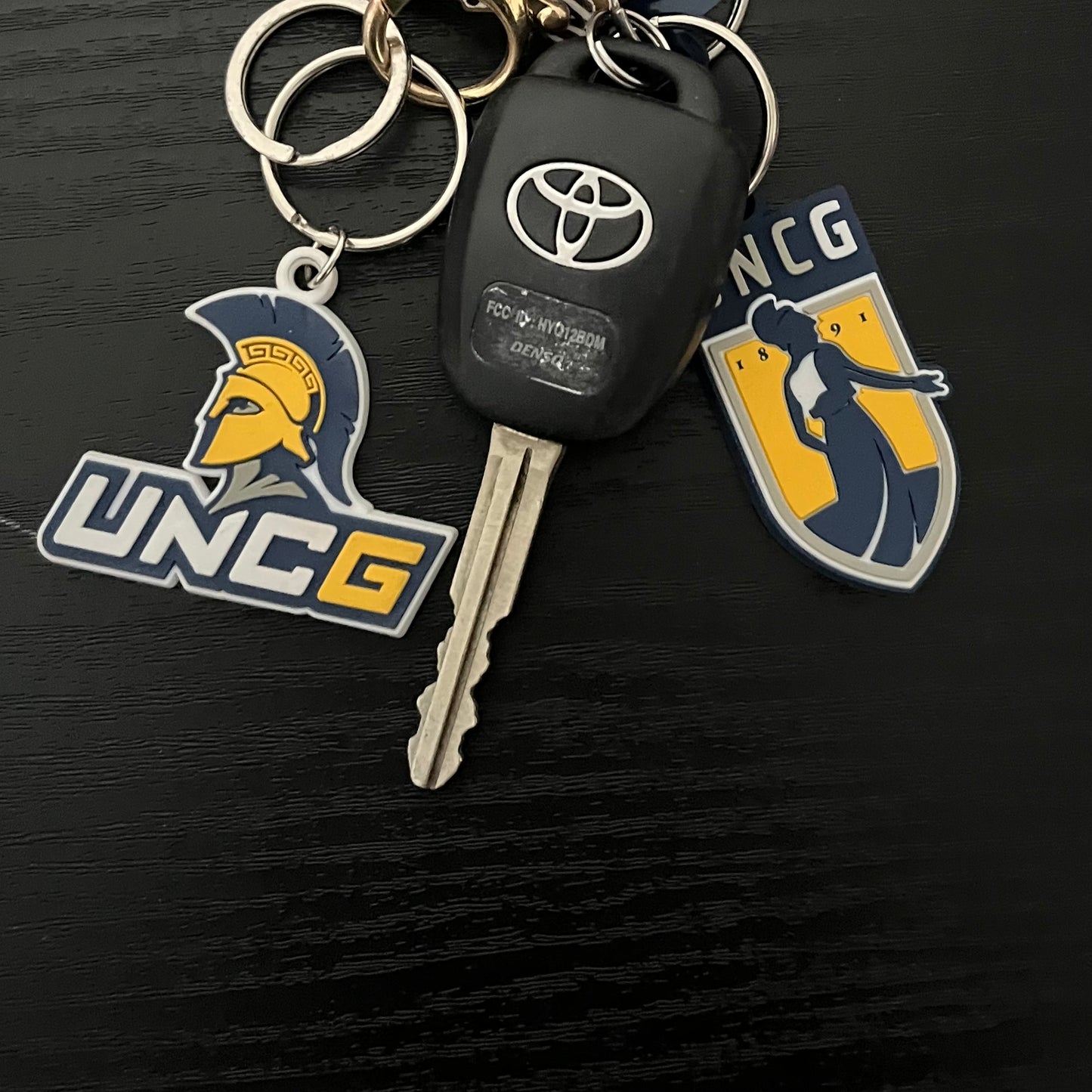 Key Chain - UNCG Emblem logo in PVC material, poly-bagged.