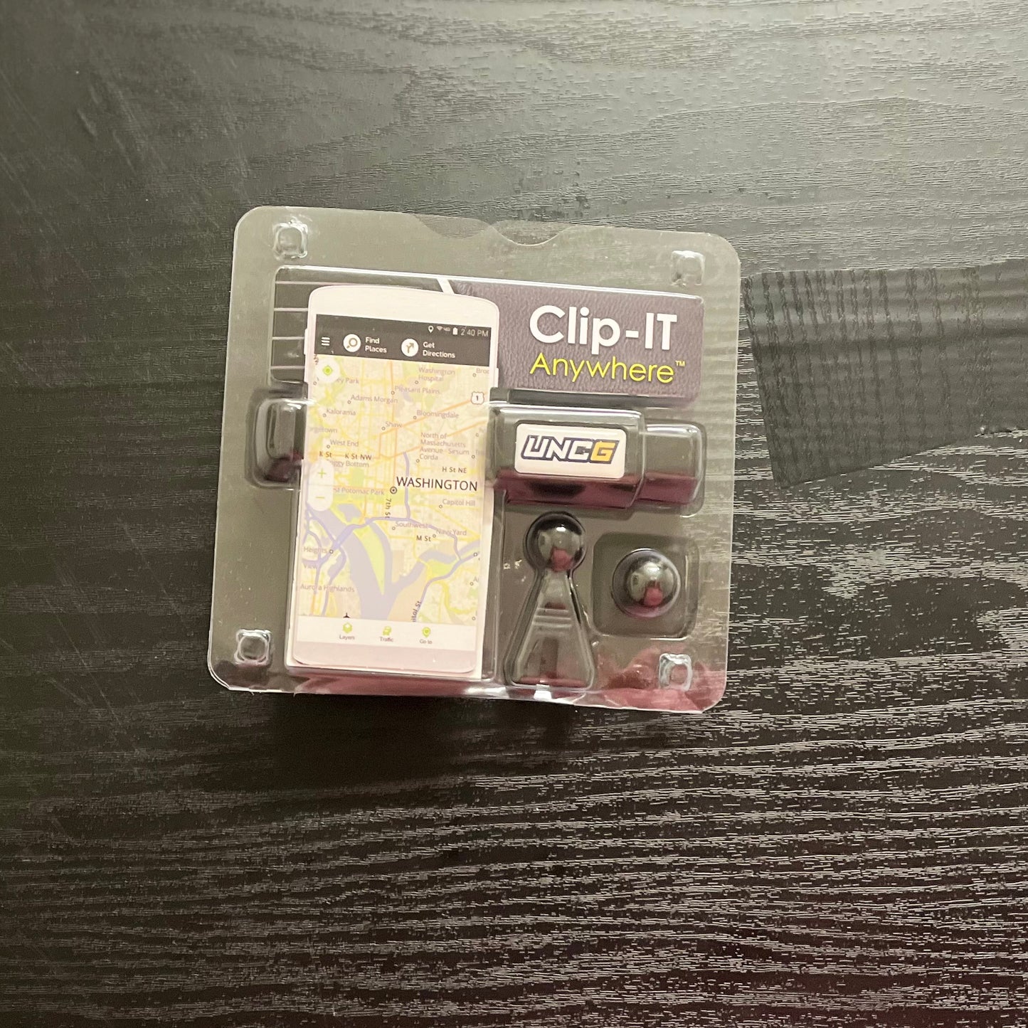 Cellphone Holder w/ UNCG logo  Mounts on car air vent or dashboard. "Clip-IT Anywhere"